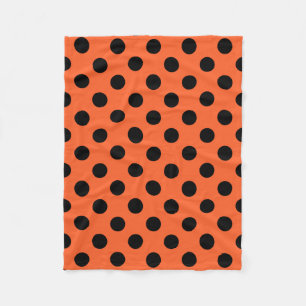 Schwarze Polka-Punkte auf Orange Fleecedecke