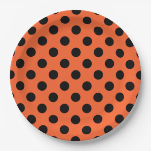 Schwarze Polka-Punkte auf Orange Pappteller
