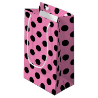 Schwarze Polka-Punkte auf Rosa