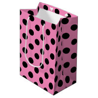 Schwarze Polka-Punkte auf Rosa