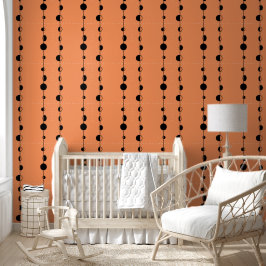Schwarze Punkte und senkrechte Linien auf Orange Tapete