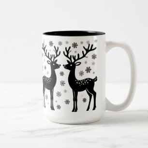 Schwarze Silhouetten von Rentieren mit fallendem W Zweifarbige Tasse