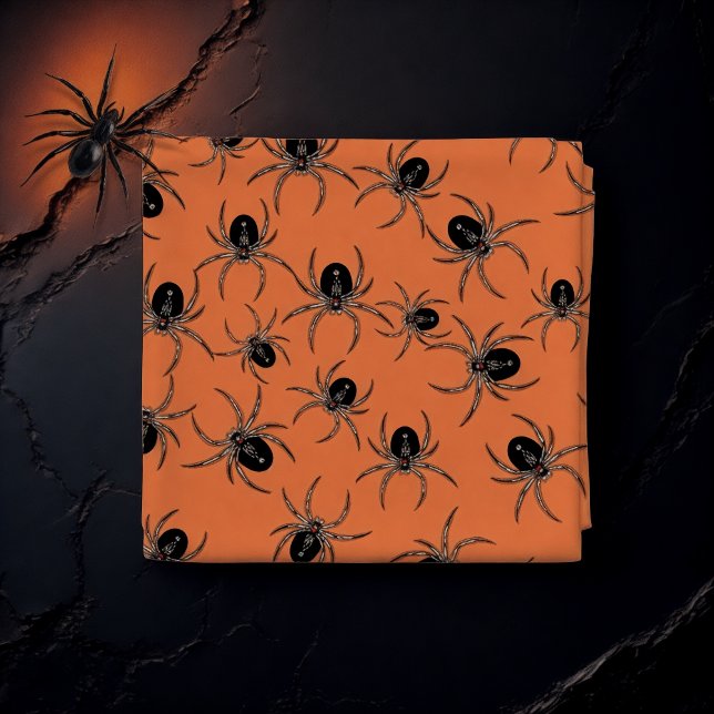 Schwarze Spinnen auf Orange Stoff (Von Creator hochgeladen)
