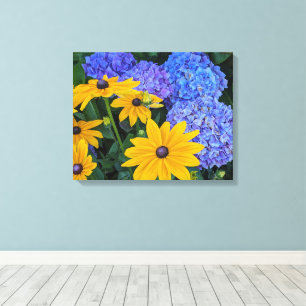 Schwarze Susanne und Blaue Hortensie Blumenbild Leinwanddruck