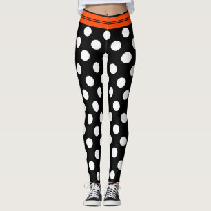 Schwarze u. weiße Retro Tupfen mit orange Streife Leggings
