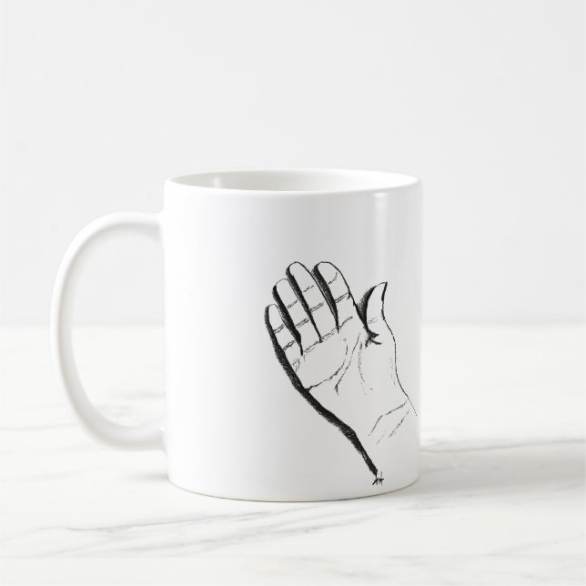 schwarze und weiße Hand auf Kaffeetasse (Links)