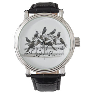 Schwarze Vögel auf einer musikalischen Komposition Armbanduhr