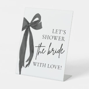 Schwarzer Bow. Wir duschen die Braut mit Liebe-Zei Sockelschild
