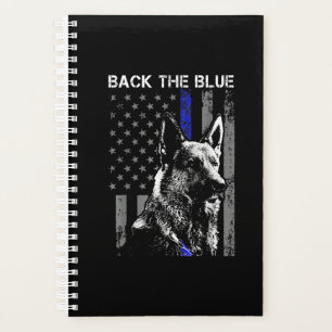 Schwarzer Schafhirte mit blauer Flagge (k-9) Planer