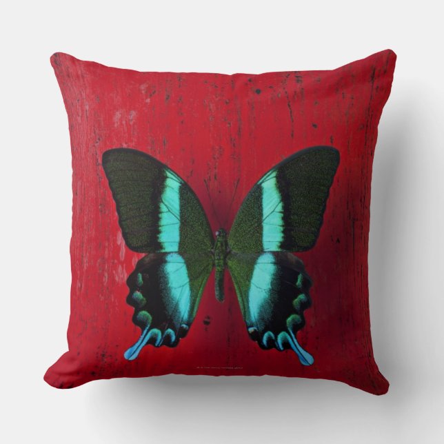 Schwarzer und blauer Schmetterling auf roter Wand Kissen (Vorderseite)