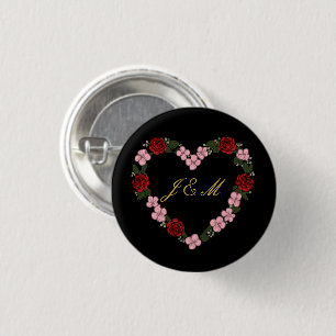 Schwarzes Abzeichen mit rosa und rotem Herzen Button
