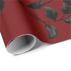 Schwarzes Blatt-Blumenrebe-Muster auf hochrotem Geschenkpapier