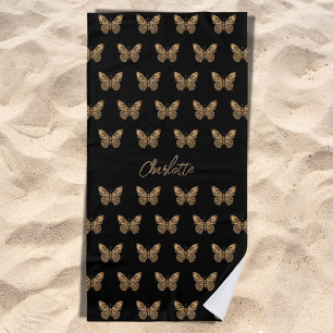 Schwarzes Goldbutterfliegenmuster Strandtuch