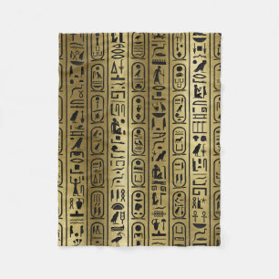 Schwarzes Hieroglyphenmuster auf altem Gold Fleecedecke