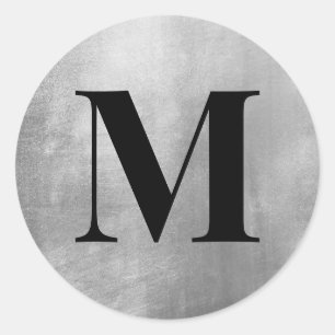 Schwarzes Monogramm auf falscher Silberfolie Runder Aufkleber