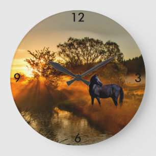 Schwarzes Pferd bei Sonnenaufgang oder Sonnenunter Große Wanduhr