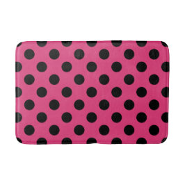 Schwarzpolka-Punkte auf Fuchsia Badematte