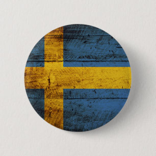 Schwedische Flagge auf alter Holzmaserung Button