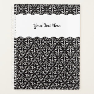 Scrolls blancs en forme de diamant sur noir