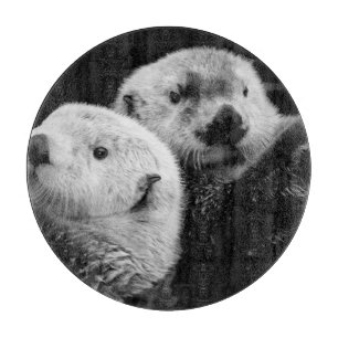 Sea Otters: Schwarz-weißes Paar. Schneidebrett