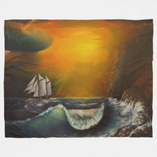 Segelboot und Sonnenuntergang an der Felsenküste Fleecedecke