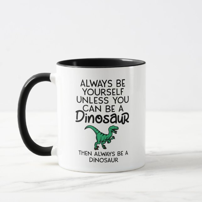 Seien Sie immer selbst, wenn Sie kein Dinosaurier  Tasse (Links)