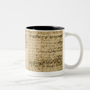 Seiten von der Kerbe der 'Kunst des Fugue Zweifarbige Tasse