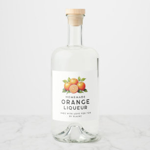 Selbstgemachter Orangenlikör mit Orangen und Blätt Alkoholflaschenetikett