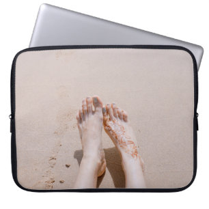 Selective focus photography of feet with tattoo on laptopschutzhülle