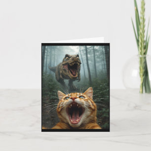 Selfie einer orangefarbenen Katze mit T-Rex-Dinosa Karte