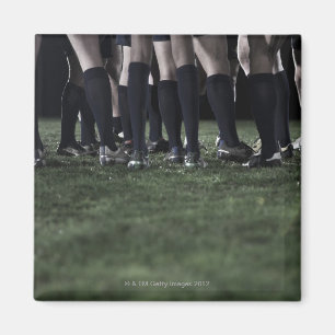 Senken Sie Abschnitt einer Gruppe Rugbyspieler Magnet