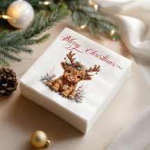 Jolie vache Highland de Noël avec des bois festifs