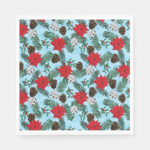 Poinsettias et cloches d'argent dans les serviette