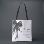She’s Tying The Knot Black Bow Bridal Shower Tasche<br><div class="desc">Celebrate the bride-to-be with this She’s Tying The Knot Black Bow Bridal Shower Tote Bag, designed with a chic coquette-inspired black bow and elegant modern typography. Perfect for bridal showers, bachelorette celebrations, and wedding events, this stylish tote makes a thoughtful gift for the bride, bridesmaids, or guests. Ideal as a...</div>