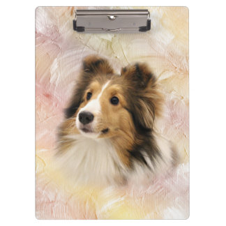 Sheltie stellen gegenüber klemmbrett