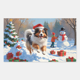 Shetland Sheepdog läuft durch Schnee mit Weihnacht Rechteckiger Aufkleber
