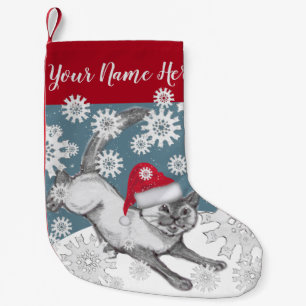 Siamische Katze in Weihnachtsmannmütze Blauer Win Kleiner Weihnachtsstrumpf