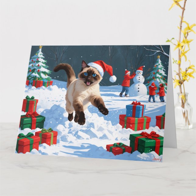 Siamische Katze läuft im Schnee mit Weihnachtsmütz Karte (Gelbe Blume)