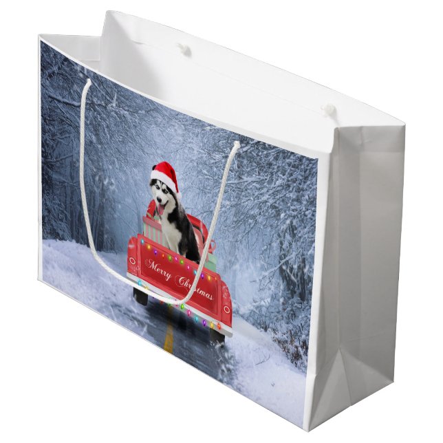 Siberischer Husky Hund im Schnee sitzend Weihnacht Große Geschenktüte (Vorderseite Schrägansicht)