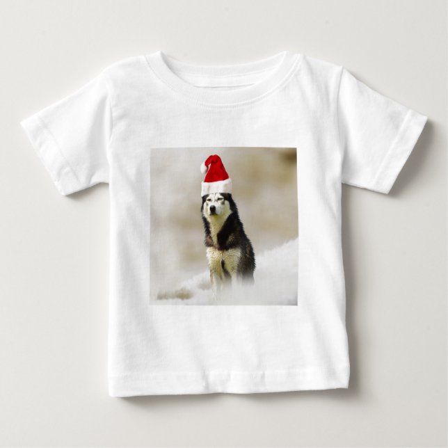 Siberischer Husky-Hund mit Weihnachtsmannmütze im  Baby T-shirt (Vorderseite)