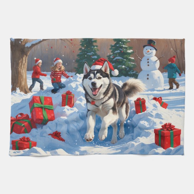 Sibirischer Husky läuft im Schnee mit Weihnachtsmü Geschirrtuch (Horizontal)