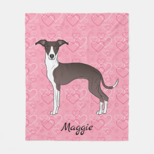 Siegel und weißer italienischer Windhund auf rosa Fleecedecke