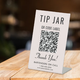 Signe De Table Code QR du pot à pourboires rose sur table