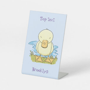 Signe De Table Illustration de dessin animé de bébé canard jaune
