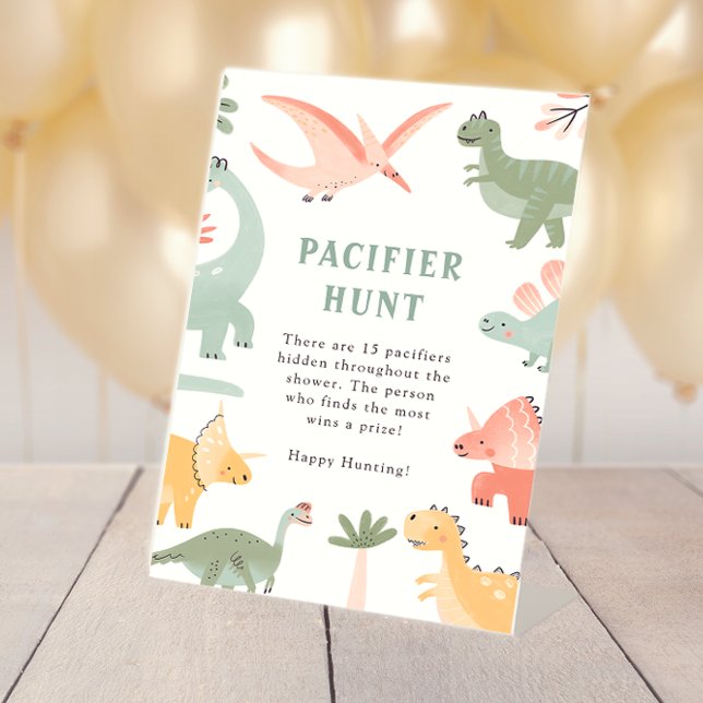 Signe De Table Pancarte Tétine de Dinosaure (Dinosaur Table Top Baby Shower Pacifier Hunt Pedestal Sign by Painted Paperie
)