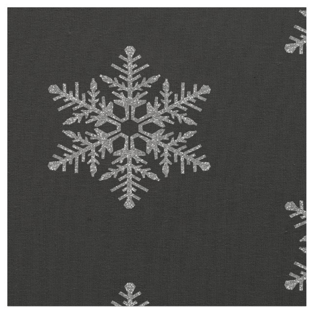 Silberne Imitat-Glitzer-Schneeflocken auf Stoff (Nahaufnahme)