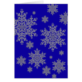 Silberne Schneeflocke überlagert auf Kobalt-Blau