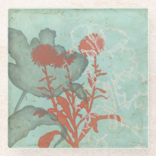 Silhouette der roten Blumen auf aquamarinem Glasuntersetzer