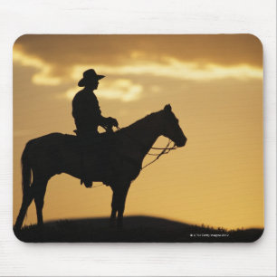 Silhouette des Cowboys auf Pferderuecken am Mousepad