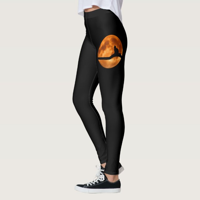 Silhouette einer schwarzen Katze in einem Baum Leggings (Links)